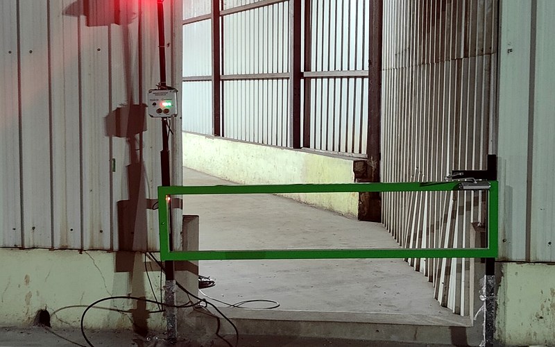People access gate with signal lights at warehouse